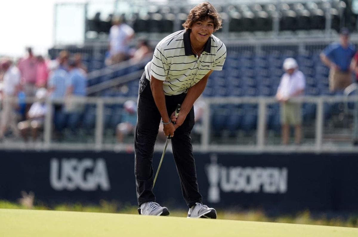 Jun 10, 2024; Pinehurst, North Carolina, USA; Charlie Woods react to his missed putt  during a practice round for his dad Tiger Woods for the U.S. Open golf tournament at Pinehurst No. 2. Mandatory Credit: Katie Goodale-USA TODAY Sports