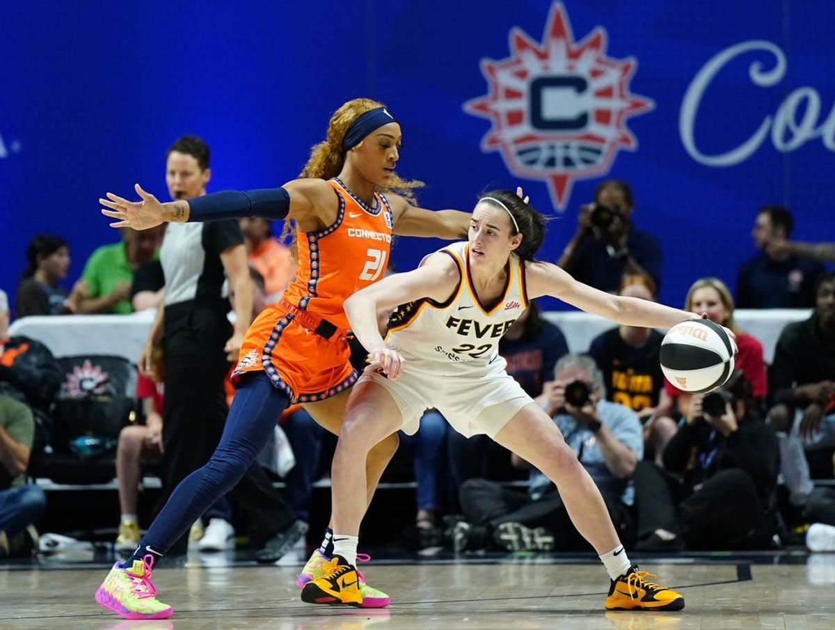 Jun 10, 2024; Uncasville, Connecticut, USA; Indiana Fever guard Caitlin Clark (22) moves the ball against Connecticut Sun guard DiJonai Carrington (21) in the first quarter at Mohegan Sun Arena. Mandatory Credit: David Butler II-USA TODAY Sports