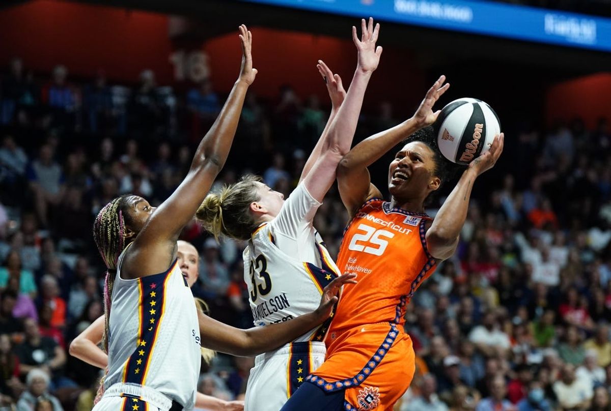 Jun 10, 2024; Uncasville, Connecticut, USA; Connecticut Sun forward Alyssa Thomas (25) shoots against Indiana Fever forward Katie Lou Samuelson (33) in the second quarter at Mohegan Sun Arena. Mandatory Credit: David Butler II-USA TODAY Sports
