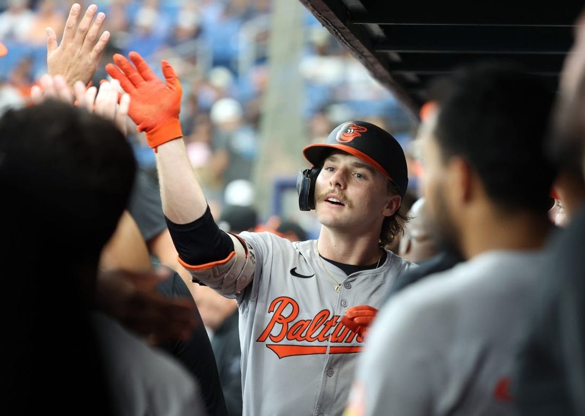Jun 10, 2024; St. Petersburg, Florida, USA;  Baltimore Orioles shortstop Gunnar Henderson (2) is congratulated by teammates after he hit a home run against the Tampa Bay Rays during the first inning at Tropicana Field. Mandatory Credit: Kim Klement Neitzel-USA TODAY Sports
