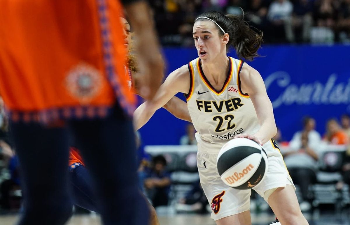Jun 10, 2024; Uncasville, Connecticut, USA; Indiana Fever guard Caitlin Clark (22) drives the ball against the Connecticut Sun in the second half at Mohegan Sun Arena. Mandatory Credit: David Butler II-USA TODAY Sports