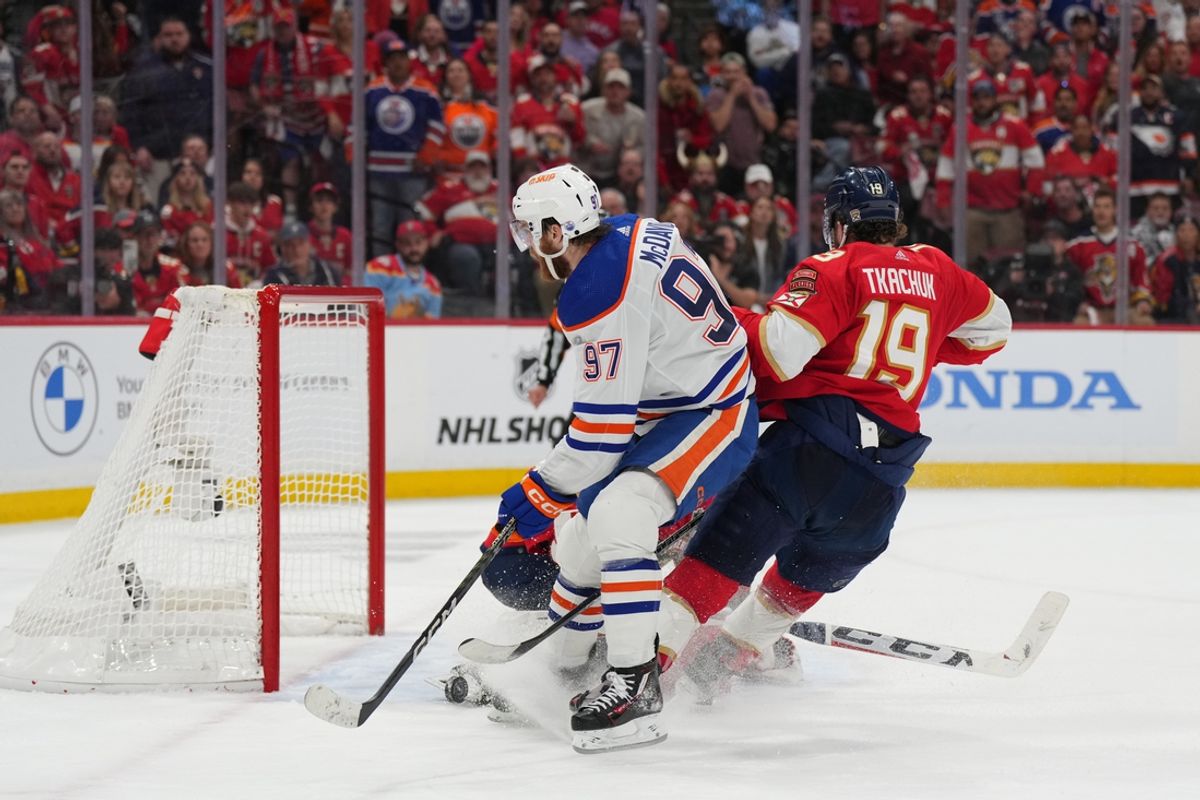 Jun 10, 2024; Sunrise, Florida, USA; Florida Panthers defenseman Brandon Montour (62) and Edmonton Oilers forward Evander Kane (91) fight during the third period in game two of the 2024 Stanley Cup Final at Amerant Bank Arena. Mandatory Credit: Jim Rassol-Imagn Images