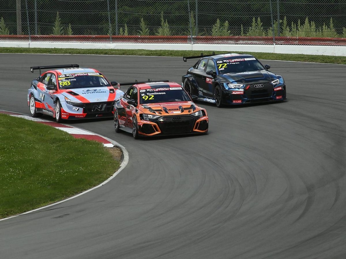 Pataskala native Riley Pegram, right, practices for a Kumho FIA TCR World Tour event at Mid-Ohio Sports Car Course in Lexington on Friday, June 7, 2024.