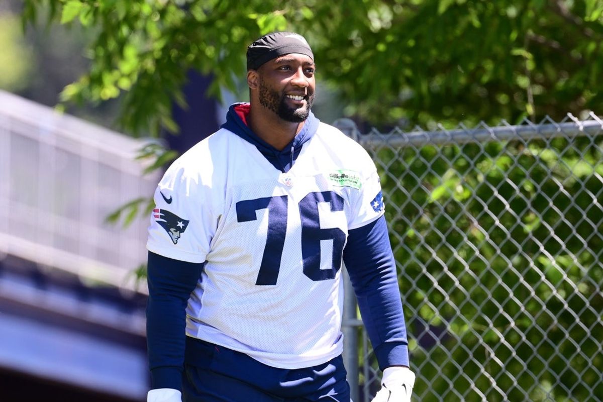 Jun 10, 2024; Foxborough, MA, USA; New England Patriots offensive tackle Calvin Anderson (76) walks to the practice fields for minicamp at Gillette Stadium. Mandatory Credit: Eric Canha-Imagn Images