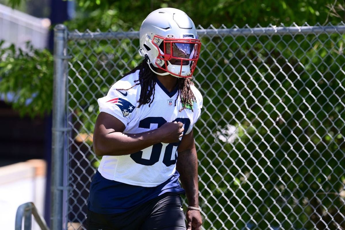Jun 10, 2024; Foxborough, MA, USA; New England Patriots running back Rhamondre Stevenson (38) walks to the practice fields for minicamp at Gillette Stadium. Mandatory Credit: Eric Canha-USA TODAY Sports