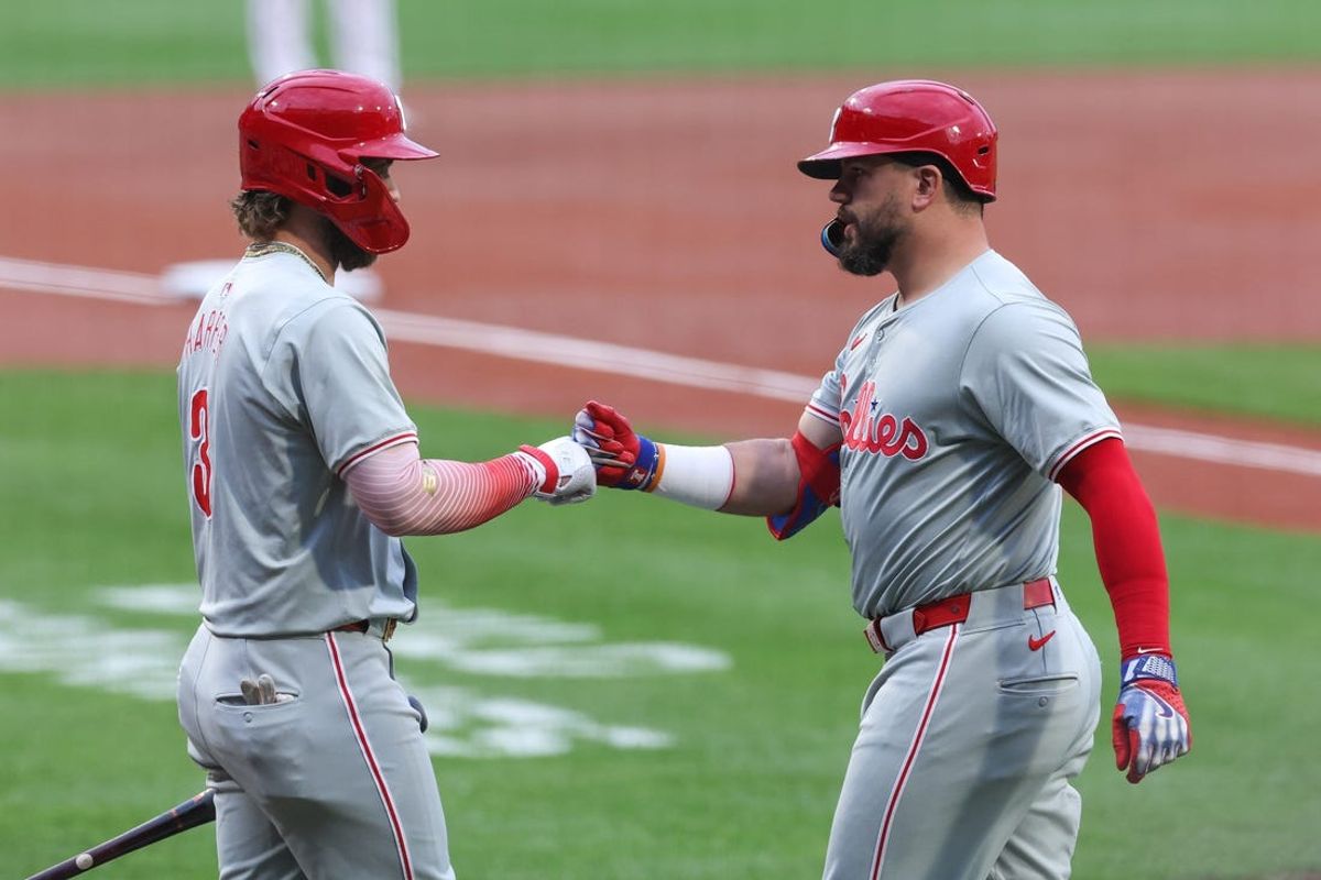 Jun 11, 2024; Boston, Massachusetts, USA; Philadelphia Phillies designated hitter Kyle Schwarber (12) celebrates with Philadelphia Phillies first baseman Bryce Harper (3) after a leadoff solo home run during the first inning against the Boston Red Sox at Fenway Park. Mandatory Credit: Paul Rutherford-USA TODAY Sports
