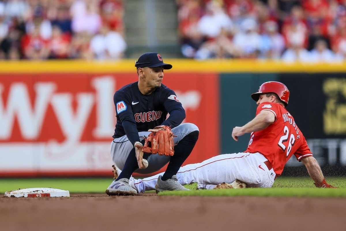 Jun 11, 2024; Cincinnati, Ohio, USA; Cincinnati Reds designated hitter Jacob Hurtubise (26) steals second against Cleveland Guardians second baseman Andres Gimenez (0) in the second inning at Great American Ball Park. Mandatory Credit: Katie Stratman-USA TODAY Sports