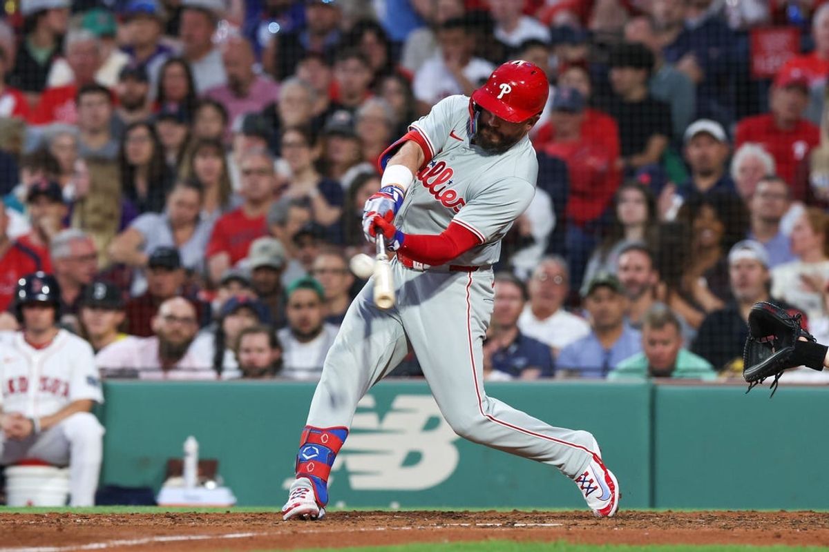 Jun 11, 2024; Boston, Massachusetts, USA; Philadelphia Phillies designated hitter Kyle Schwarber (12) hits a solo home run during the fifth inning against the Boston Red Sox at Fenway Park. Mandatory Credit: Paul Rutherford-USA TODAY Sports
