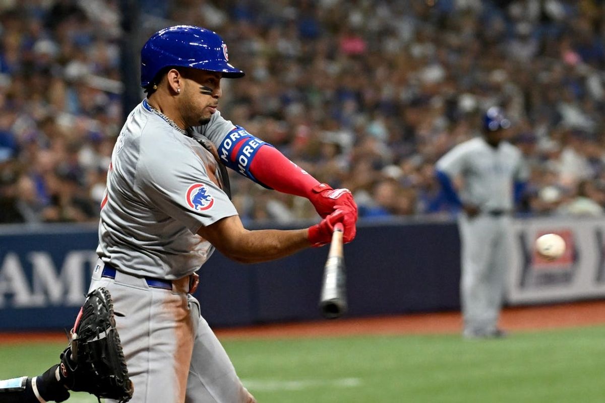 Jun 11, 2024; St. Petersburg, Florida, USA; Chicago Cubs third baseman Christopher Morel (5) hits a single in the sixth inning against the Tampa Bay Rays at Tropicana Field. Mandatory Credit: Jonathan Dyer-USA TODAY Sports