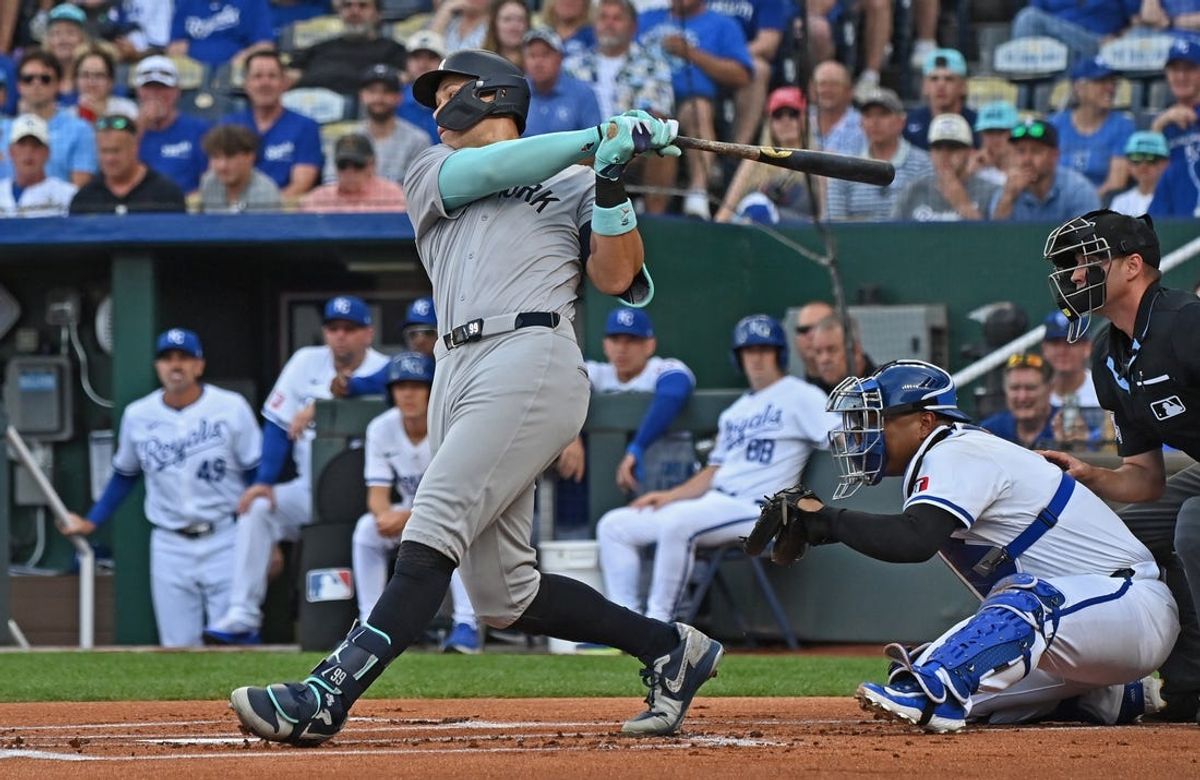 Jun 11, 2024; Kansas City, Missouri, USA; New York Yankees center fielder Aaron Judge (99) hits an RBI single in the first inning against the Kansas City Royals at Kauffman Stadium. Mandatory Credit: Peter Aiken-USA TODAY Sports