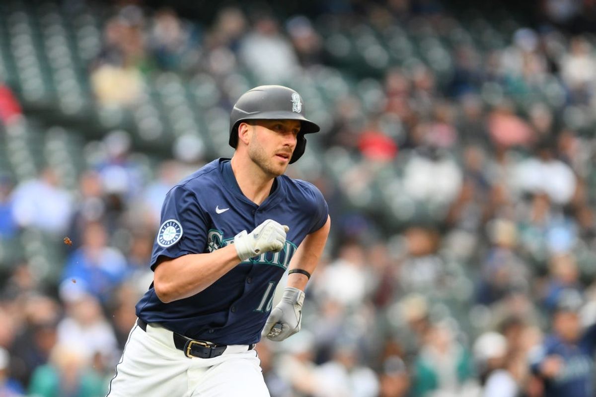 Jun 11, 2024; Seattle, Washington, USA; Seattle Mariners designated hitter Mitch Garver (18) runs towards first base after hitting an RBI double against the Chicago White Sox during the second inning at T-Mobile Park. Mandatory Credit: Steven Bisig-USA TODAY Sports