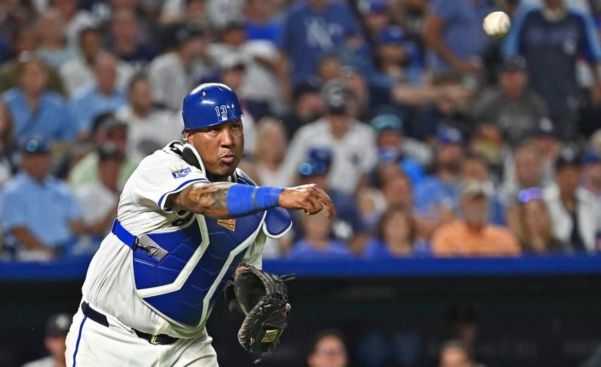 Jun 11, 2024; Kansas City, Missouri, USA; Kansas City Royals catcher Salvador Perez (13) throws the ball to first base for an out in the seventh inning against the New York Yankees at Kauffman Stadium. Mandatory Credit: Peter Aiken-USA TODAY Sports