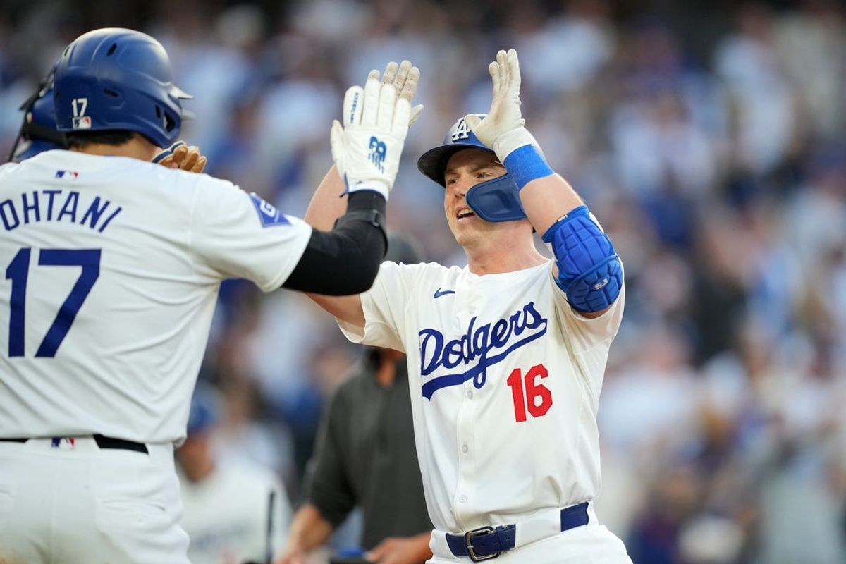 Jun 11, 2024; Los Angeles, California, USA; Los Angeles Dodgers catcher Will Smith (16) celebrates with designated hitter Shohei Ohtani (17) after hitting a three-run home run in the first inning at Dodger Stadium. Mandatory Credit: Kirby Lee-USA TODAY Sports