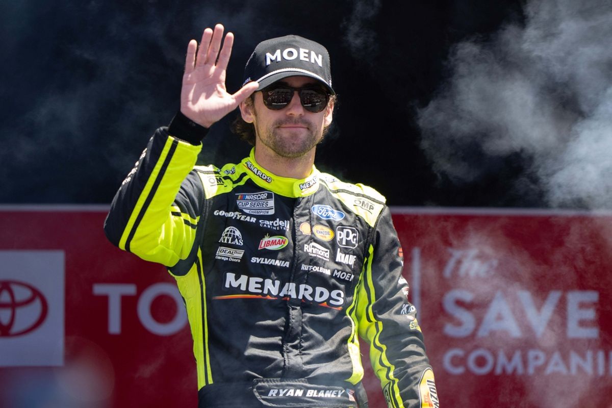 Jun 9, 2024; Sonoma, California, USA;  NASCAR Cup Series driver Ryan Blaney (12) waves as he gets introduced to fans before the start of the Toyota / Save Mart 350 at Sonoma Raceway. Mandatory Credit: Stan Szeto-Imagn Images