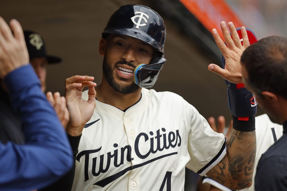 Jun 12, 2024; Minneapolis, Minnesota, USA; Minnesota Twins shortstop Carlos Correa (4) celebrates run against the Colorado Rockies in the sixth inning at Target Field. Mandatory Credit: Bruce Kluckhohn-USA TODAY Sports