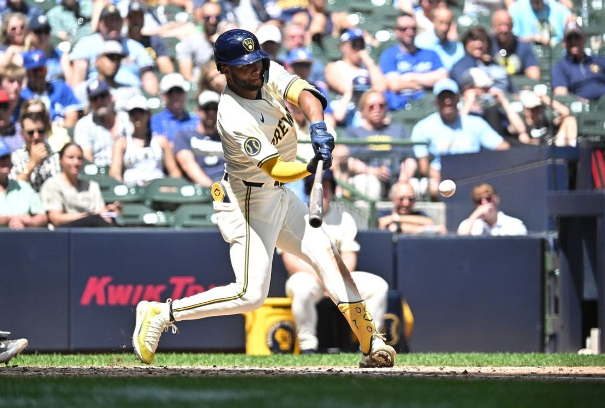 Jun 12, 2024; Milwaukee, Wisconsin, USA;  Milwaukee Brewers outfielder Jackson Chourio (11) gets a base hit against the Toronto Blue Jays in the fourth inning at American Family Field. Mandatory Credit: Michael McLoone-USA TODAY Sports