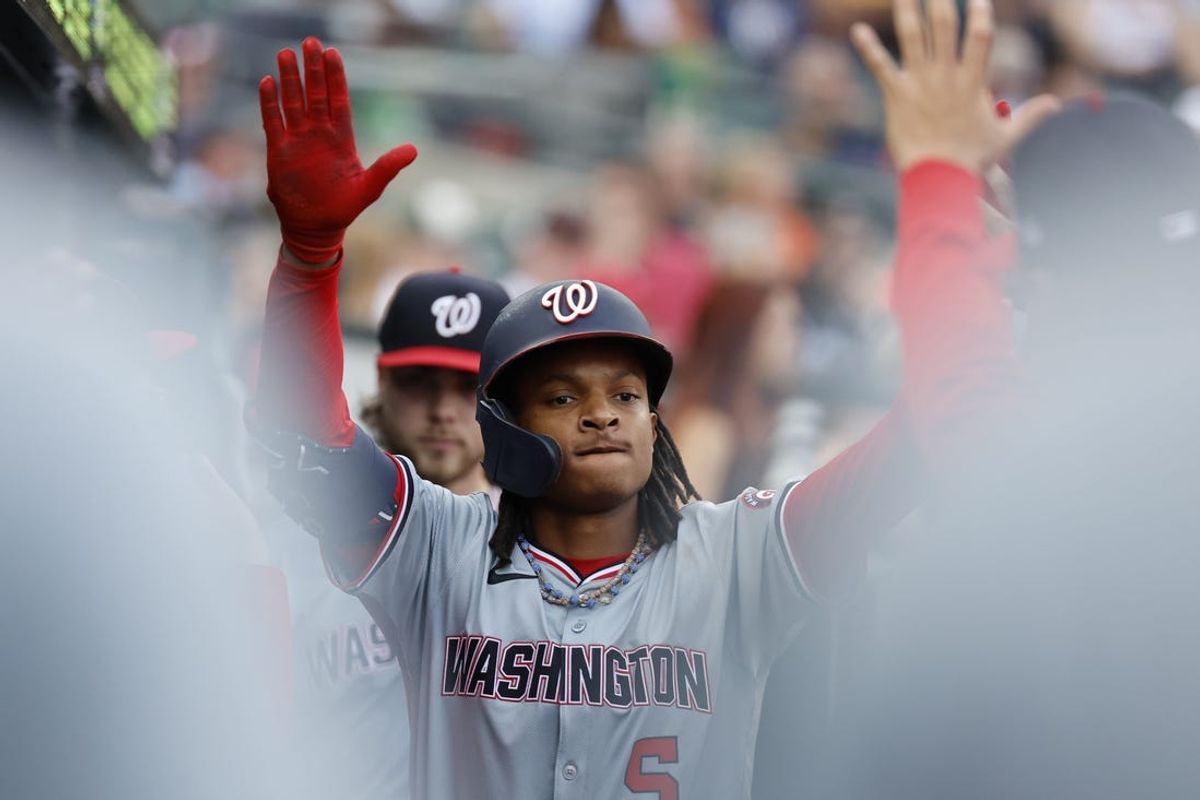 Jun 12, 2024; Detroit, Michigan, USA;  Washington Nationals shortstop CJ Abrams (5) reacts with teammates after hitting a home run in the third inning against the Detroit Tigers at Comerica Park. Mandatory Credit: Rick Osentoski-USA TODAY Sports