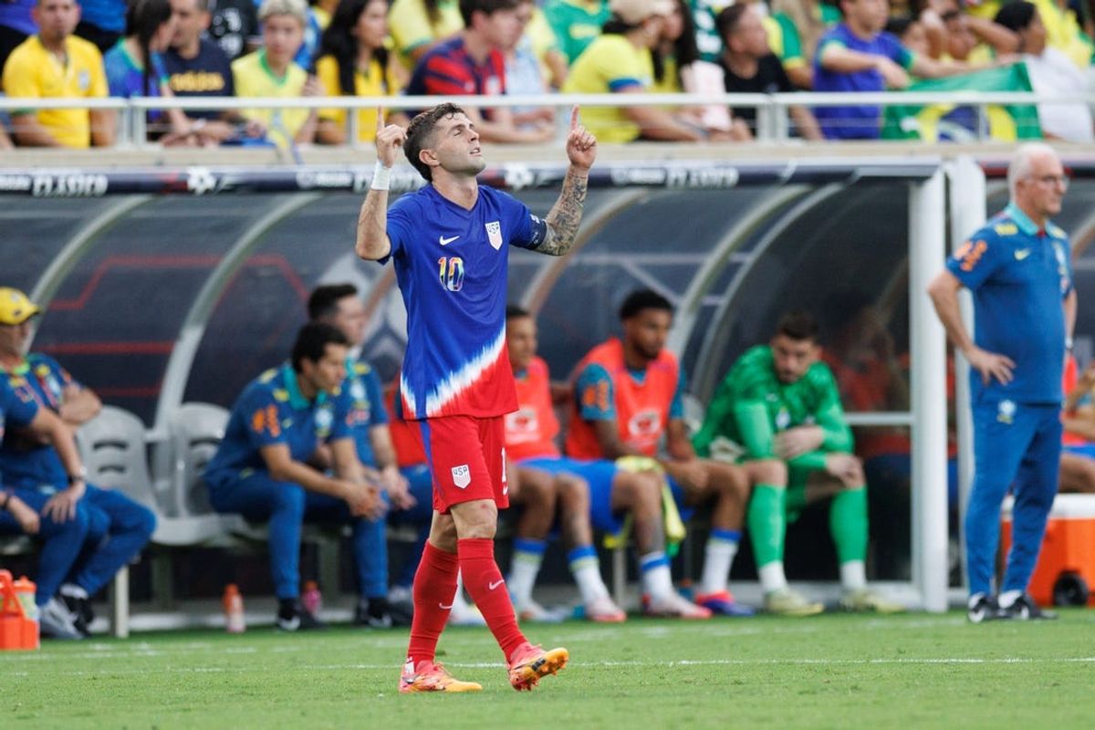 Jun 12, 2024; Orlando, Florida, USA;  United States midfielder Christian Pulisic (10) celebrates after scoring a goal against Brazil in the first half during the Continental Clasico at Camping World Stadium. Mandatory Credit: Nathan Ray Seebeck-USA TODAY Sports