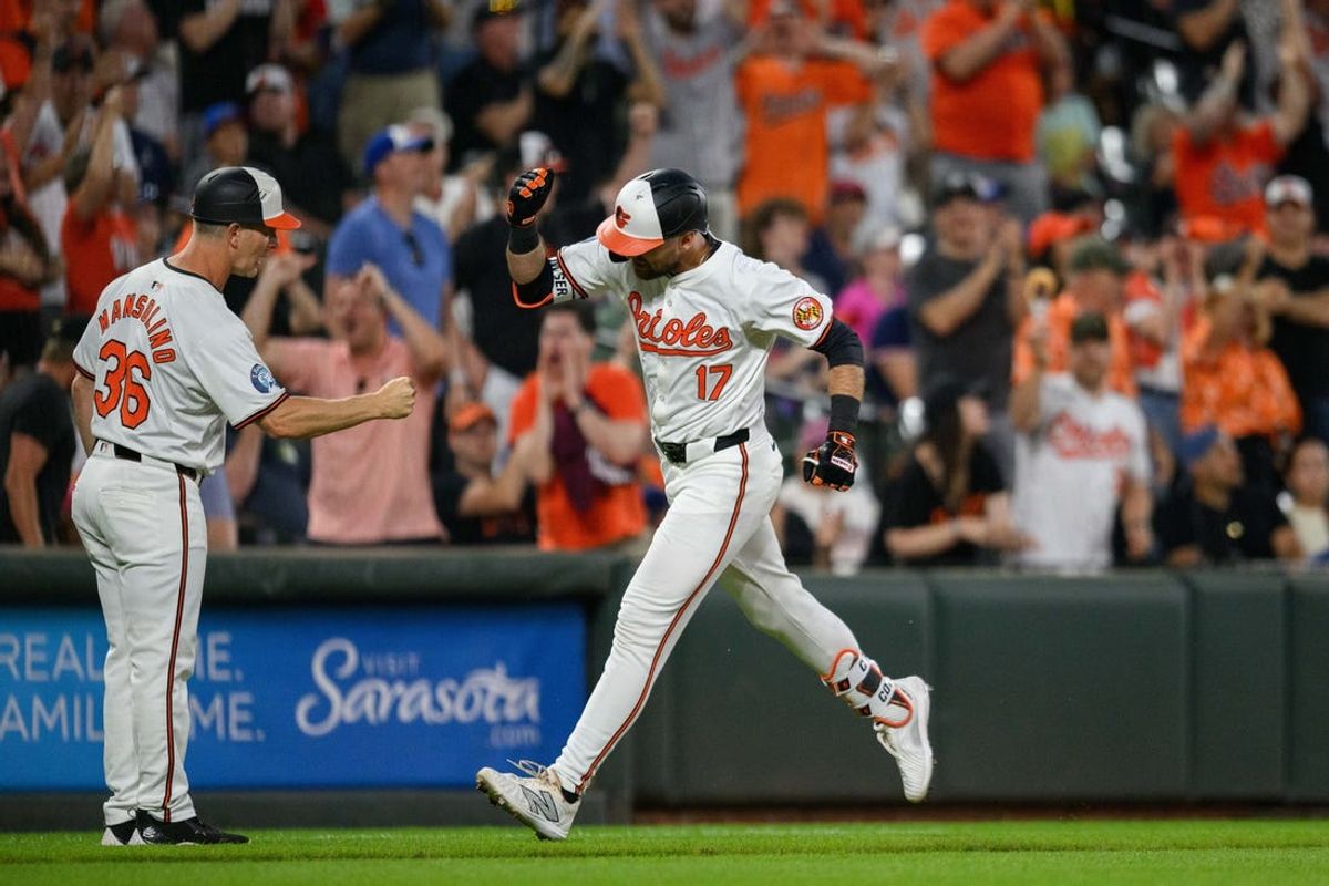 Jun 12, 2024; Baltimore, Maryland, USA; Baltimore Orioles outfielder Colton Cowser (17) celebrates with third base coach Tony Mansolino (36) after hitting a home run during the eighth inning against the Atlanta Braves at Oriole Park at Camden Yards. Mandatory Credit: Reggie Hildred-USA TODAY Sports