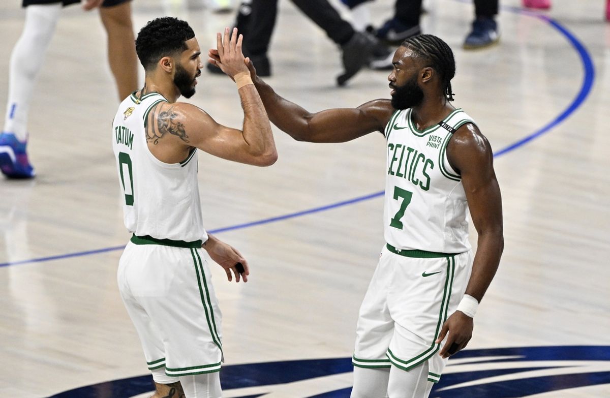 Jun 12, 2024; Dallas, Texas, USA; Boston Celtics forward Jayson Tatum (0) and guard Jaylen Brown (7) celebrate after a play during the first quarter in game three of the 2024 NBA Finals against the Dallas Mavericks at American Airlines Center. Mandatory Credit: Jerome Miron-Imagn Images