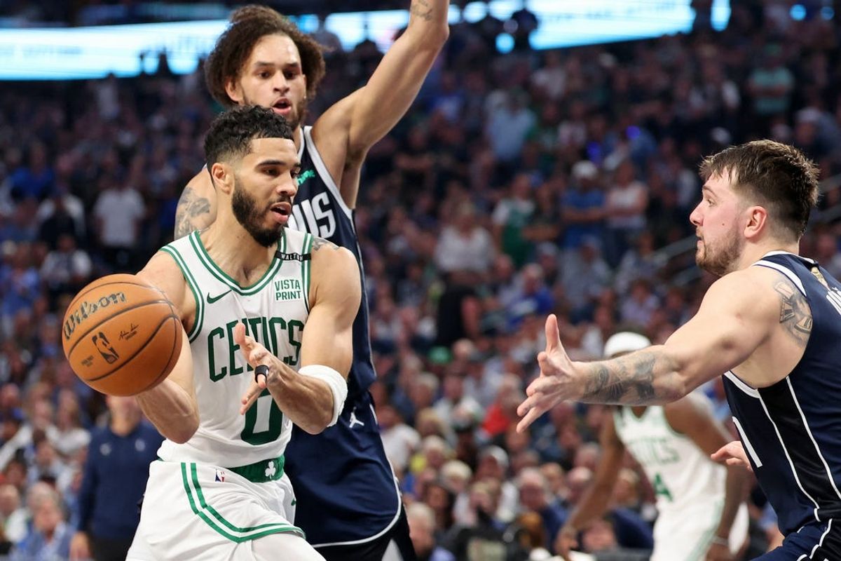 Jun 12, 2024; Dallas, Texas, USA; Boston Celtics forward Jayson Tatum (0) looks to pass the ball against Dallas Mavericks guard Luka Doncic (77) during the second quarter during game three of the 2024 NBA Finals at American Airlines Center. Mandatory Credit: Kevin Jairaj-USA TODAY Sports