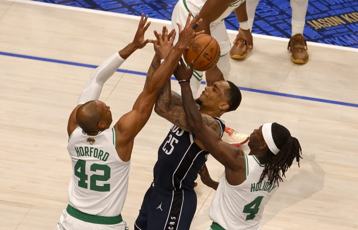Jun 12, 2024; Dallas, Texas, USA; Dallas Mavericks forward P.J. Washington (25) fights with Boston Celtics center Al Horford (42) and guard Jrue Holiday (4) for a loose ball during the second quarter in game three of the 2024 NBA Finals at American Airlines Center. Mandatory Credit: Peter Casey-USA TODAY Sports