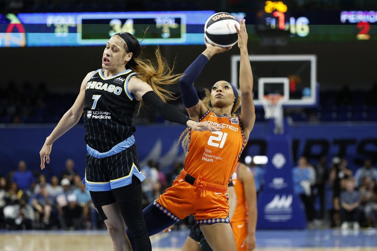 Jun 12, 2024; Chicago, Illinois, USA; Connecticut Sun guard DiJonai Carrington (21) shoots against Chicago Sky guard Chennedy Carter (7) during the first half of a basketball game at Wintrust Arena. Mandatory Credit: Kamil Krzaczynski-USA TODAY Sports