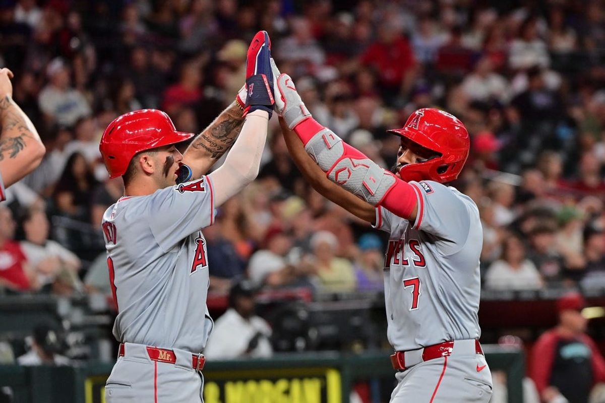 Jun 12, 2024; Phoenix, Arizona, USA; Los Angeles Angels outfielder Jo Adell (7) celebrates with shortstop Zach Neto (9) after hitting a three run home run in the fourth inning against the Arizona Diamondbacks at Chase Field. Mandatory Credit: Matt Kartozian-USA TODAY Sports