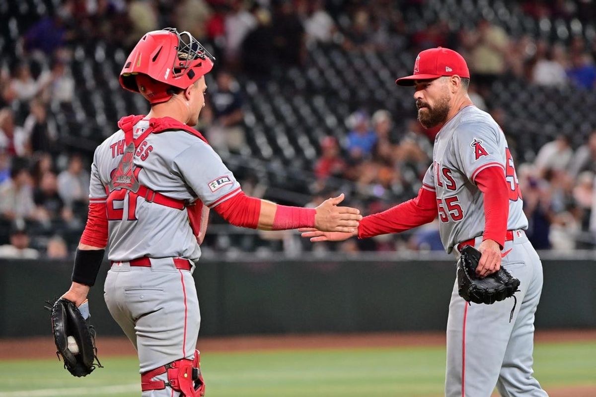 Jun 12, 2024; Phoenix, Arizona, USA; Los Angeles Angels pitcher Matt Moore (55) celebrates with catcher Matt Thaiss (21) after beating the Arizona Diamondbacks 8-3 at Chase Field. Mandatory Credit: Matt Kartozian-USA TODAY Sports