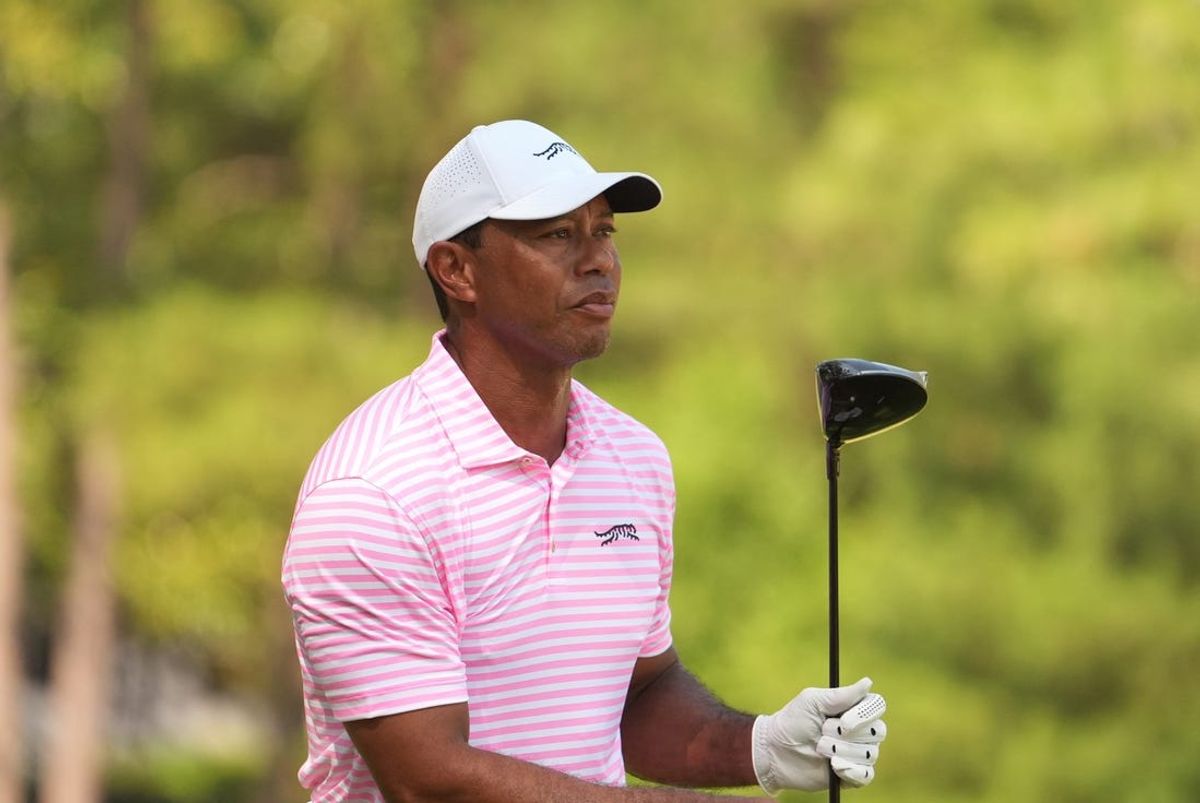 Jun 13, 2024; Pinehurst, North Carolina, USA; Tiger Woods reacts after playing his shot from the second tee box during the first round of the U.S. Open golf tournament. Mandatory Credit: John David Mercer-USA TODAY Sports