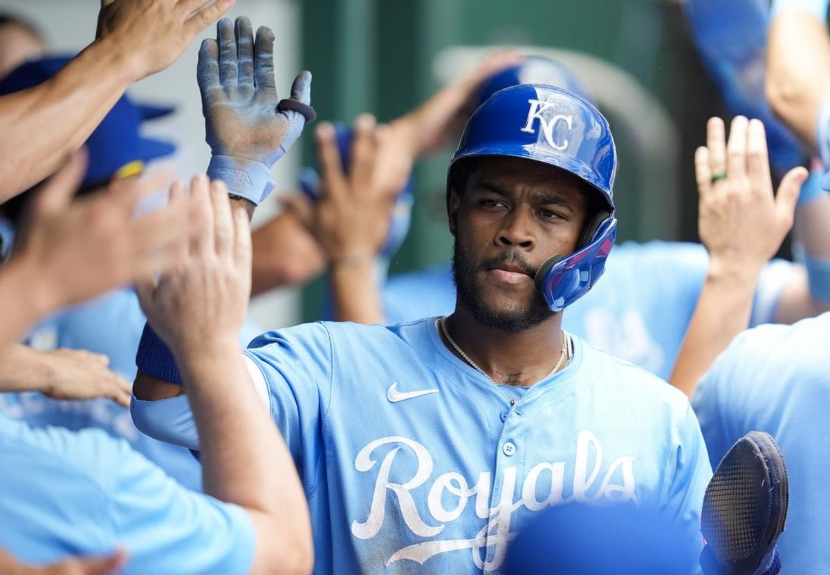 Jun 13, 2024; Kansas City, Missouri, USA; Kansas City Royals third baseman Maikel Garcia (11) is congratulated by teammates after scoring a run during the fourth inning against the New York Yankees at Kauffman Stadium. Mandatory Credit: Jay Biggerstaff-USA TODAY Sports