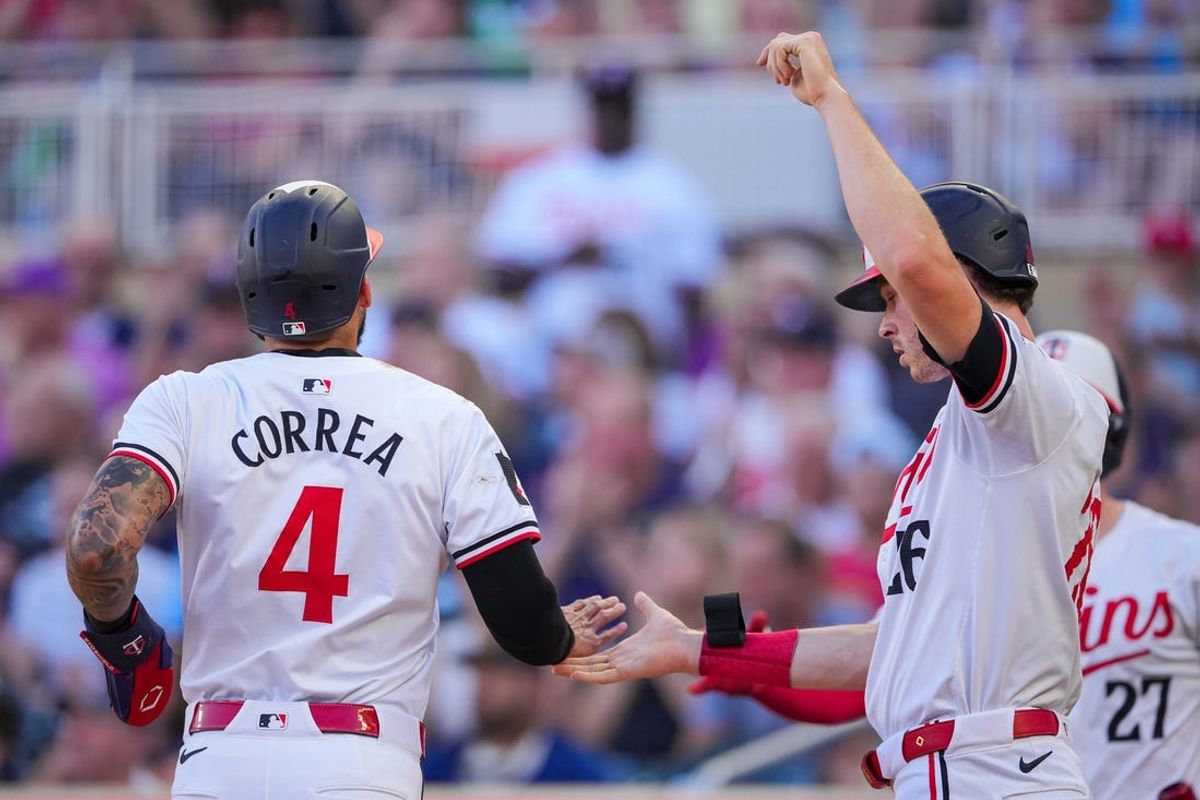 Jun 13, 2024; Minneapolis, Minnesota, USA; Minnesota Twins outfielder Max Kepler (26) and shortstop Carlos Correa (4) celebrate after scoring against the Oakland Athletics in the second inning at Target Field. Mandatory Credit: Brad Rempel-USA TODAY Sports