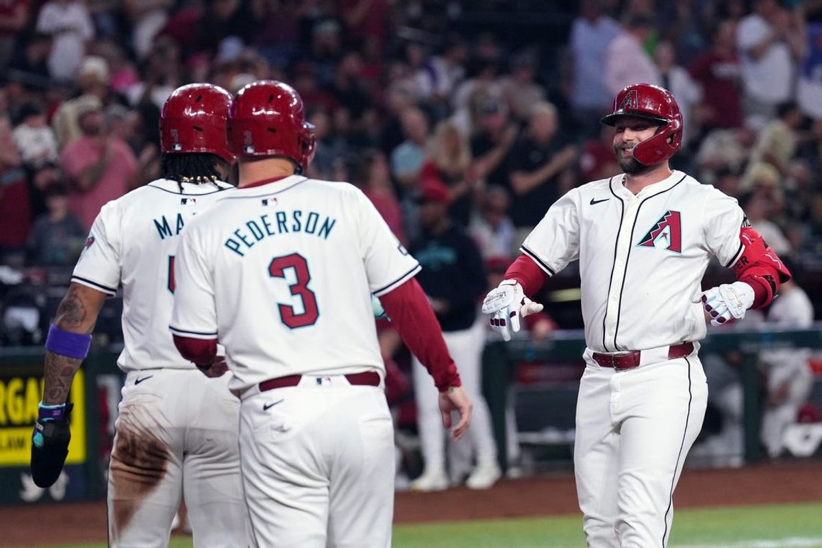 Jun 13, 2024; Phoenix, Arizona, USA; Arizona Diamondbacks first base Christian Walker (53) celebrates with Arizona Diamondbacks second base Ketel Marte (4) and Arizona Diamondbacks designated hitter Joc Pederson (3) after hitting a three run home run against the Los Angeles Angels during the first inning at Chase Field. Mandatory Credit: Joe Camporeale-USA TODAY Sports