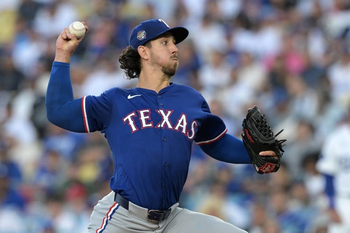 Jun 13, 2024; Los Angeles, California, USA;  Texas Rangers starting pitcher Michael Lorenzen (23) delivers to the plate in the first inning against the Los Angeles Dodgers at Dodger Stadium. Mandatory Credit: Jayne Kamin-Oncea-USA TODAY Sports