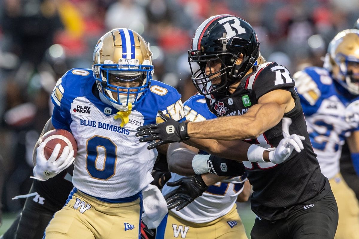 Jun 13, 2024; Ottawa, Ontario, CAN; Winnipeg Blue Bombers wide receiver Myron Mitchell (0) runs the ball with Ottawa REDBLACKS defensive back Ty Cranston (33) blocking in the first half at TD Place. Mandatory Credit: Marc DesRosiers-Imagn Images