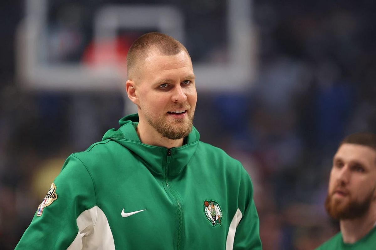 Jun 14, 2024; Dallas, Texas, USA; Boston Celtics center Kristaps Porzingis (8) looks on before game four of the 2024 NBA Finals against the Dallas Mavericks at American Airlines Center. Mandatory Credit: Peter Casey-USA TODAY Sports
