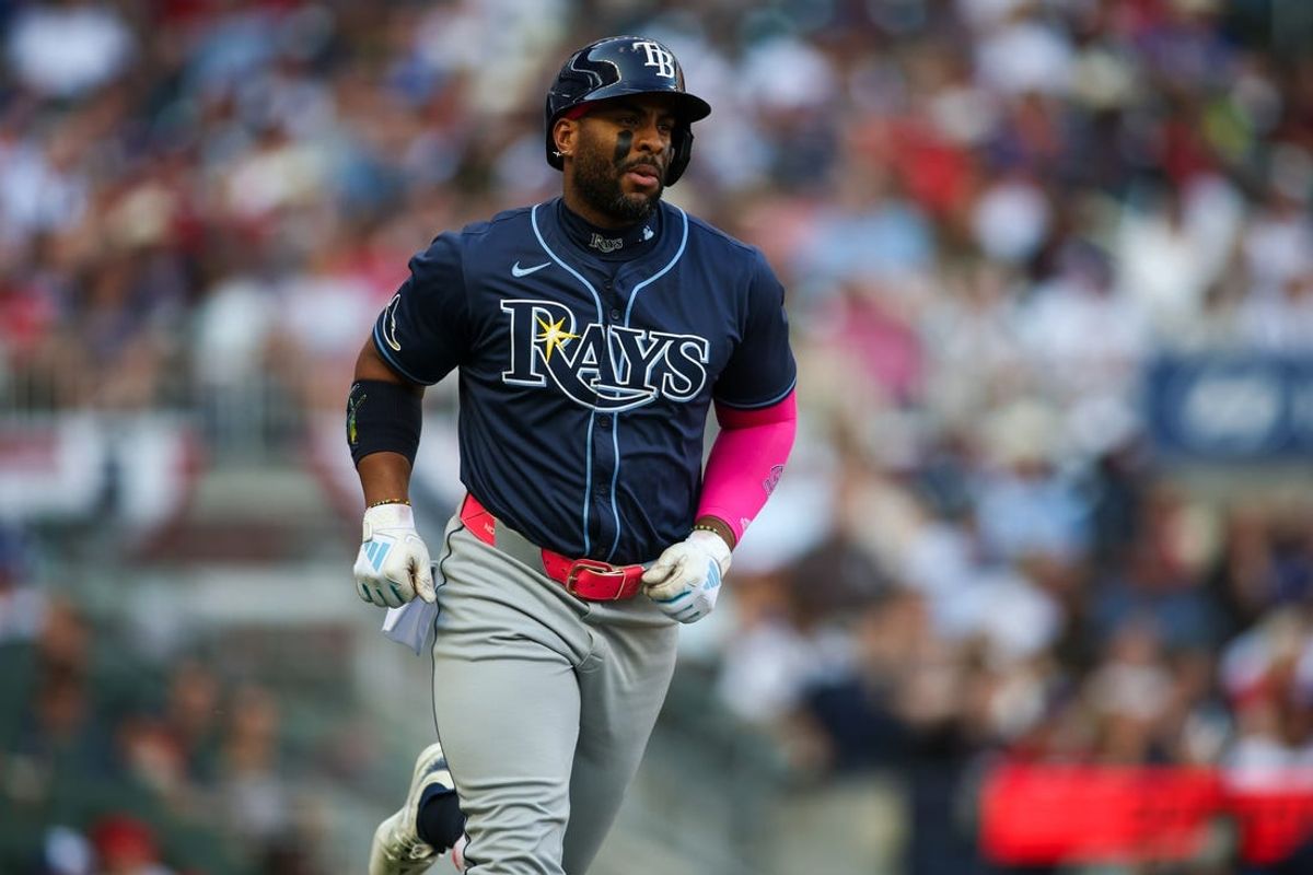 Jun 14, 2024; Atlanta, Georgia, USA; Tampa Bay Rays first baseman Yandy Diaz (2) hits a single against the Atlanta Braves in the first inning at Truist Park. Mandatory Credit: Brett Davis-USA TODAY Sports