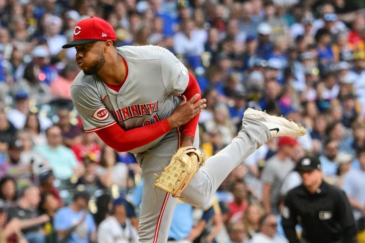 Jun 14, 2024; Milwaukee, Wisconsin, USA; Cincinnati Reds starting pitcher Hunter Greene (21) pitches against the Milwaukee Brewers in the first inning at American Family Field. Mandatory Credit: Benny Sieu-USA TODAY Sports