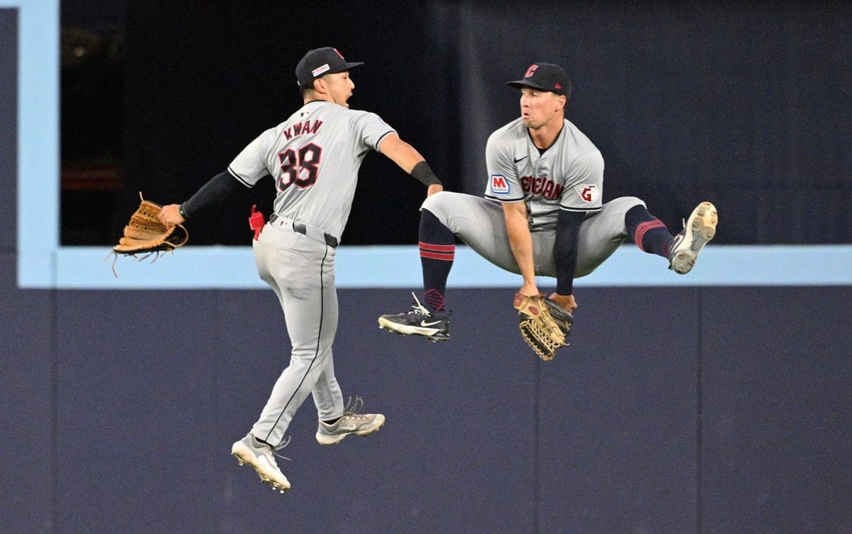 Jun 14, 2024; Toronto, Ontario, CAN;  Cleveland Guardians left fielder Steven Kwan (38) and right fielder Will Brennan (17) celebrate after a win over the Toronto Blue Jays at Rogers Centre. Mandatory Credit: Dan Hamilton-USA TODAY Sports
