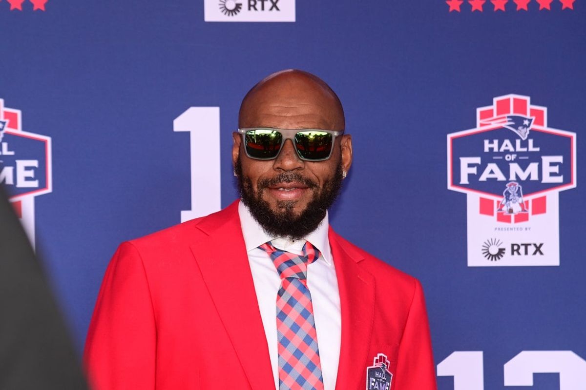 Jun 12, 2024; Foxborough, MA, USA; Former NFL player Kevin Faulk stops on the red carpet for a photo  at the New England Patriots Hall of Fame induction ceremony for Tom Brady at Gillette Stadium. Mandatory Credit: Eric Canha-Imagn Images