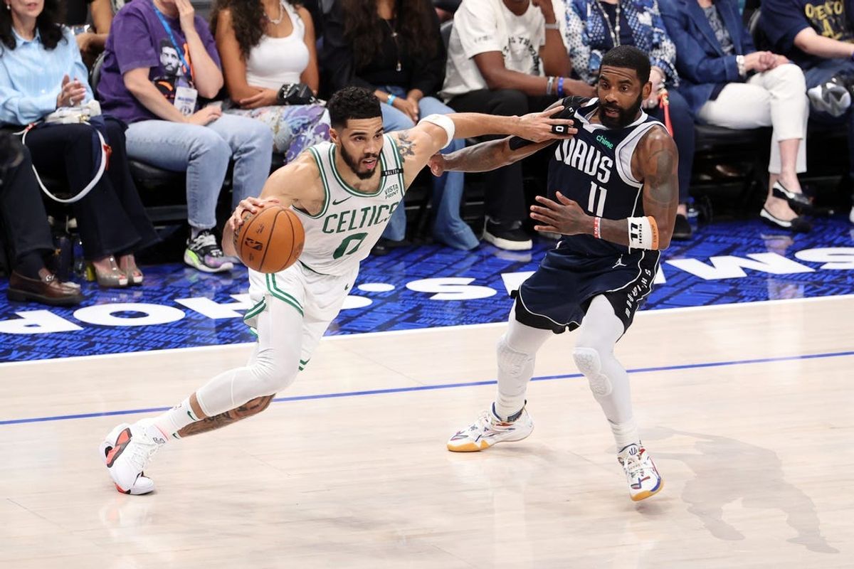 Jun 14, 2024; Dallas, Texas, USA; Boston Celtics forward Jayson Tatum (0) drives to the basket against Dallas Mavericks guard Kyrie Irving (11) during the second quarter during game four of the 2024 NBA Finals at American Airlines Center. Mandatory Credit: Peter Casey-USA TODAY Sports