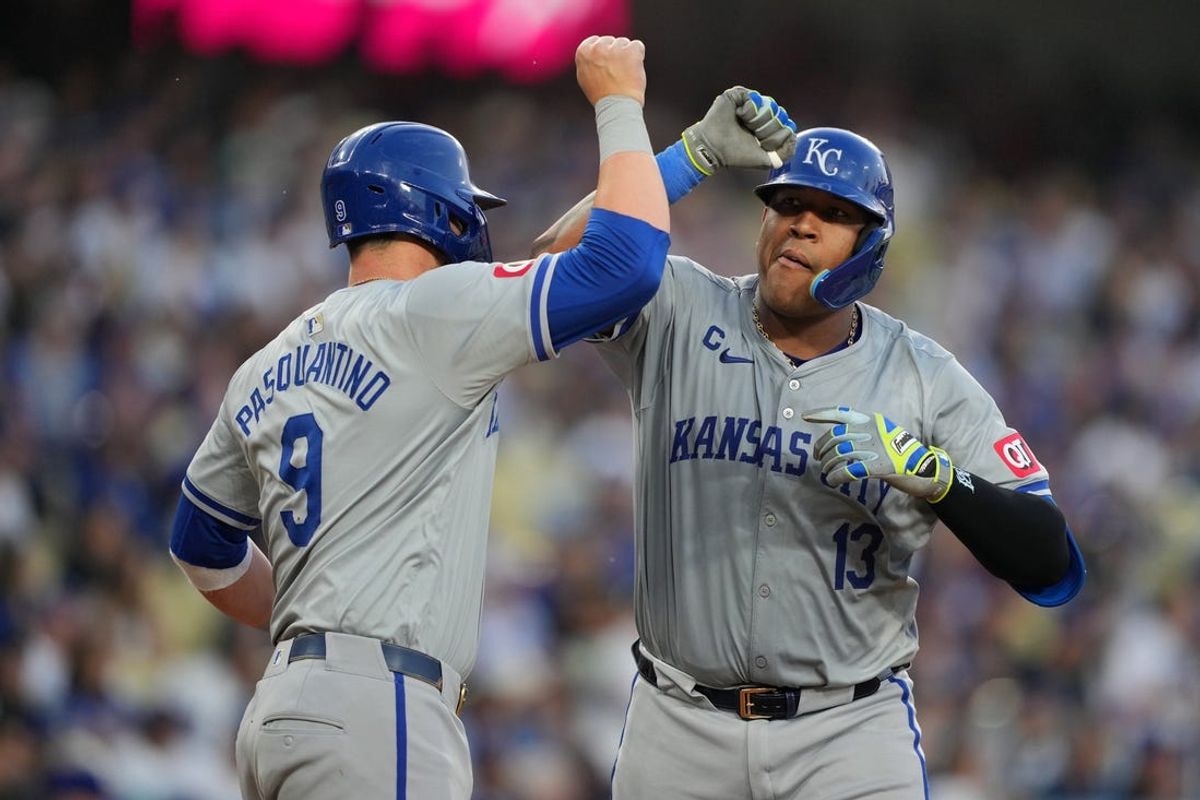 Jun 14, 2024; Los Angeles, California, USA; Kansas City Royals catcher Salvador Perez (13) celebrates with first baseman Vinnie Pasquantino (9) after hitting a three-run home run in the second inning against the Los Angeles Dodgers at Dodger Stadium. Mandatory Credit: Kirby Lee-USA TODAY Sports