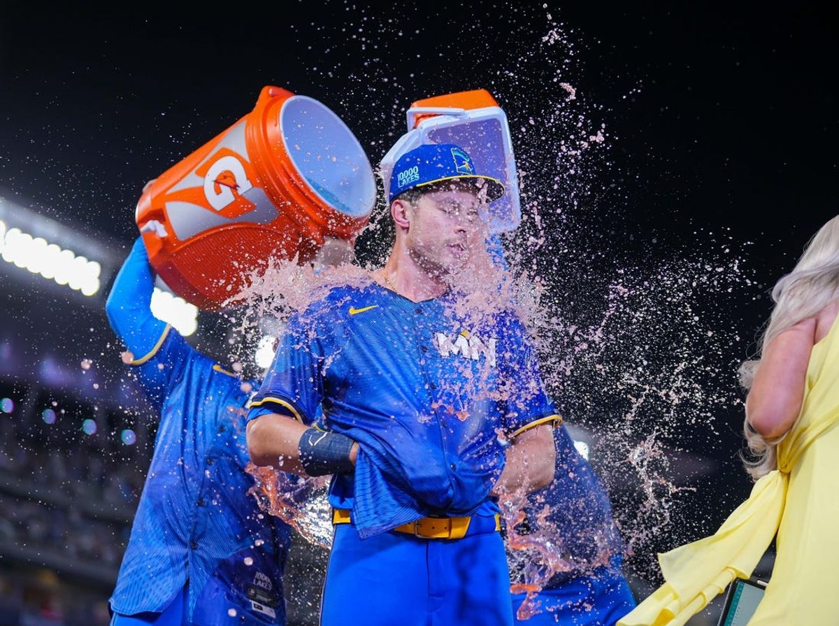 Jun 14, 2024; Minneapolis, Minnesota, USA; Minnesota Twins outfielder Max Kepler (26) gets a Gatorade bath after his game winning base hit against the Oakland Athletics in the tenth inning at Target Field. Mandatory Credit: Brad Rempel-USA TODAY Sports