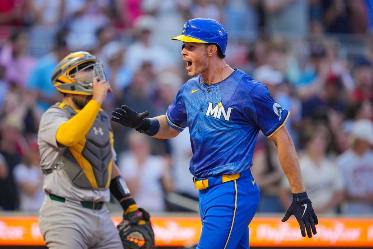Jun 14, 2024; Minneapolis, Minnesota, USA; Minnesota Twins outfielder Max Kepler (26) celebrates his home run against the Oakland Athletics in the sixth inning at Target Field. Mandatory Credit: Brad Rempel-USA TODAY Sports