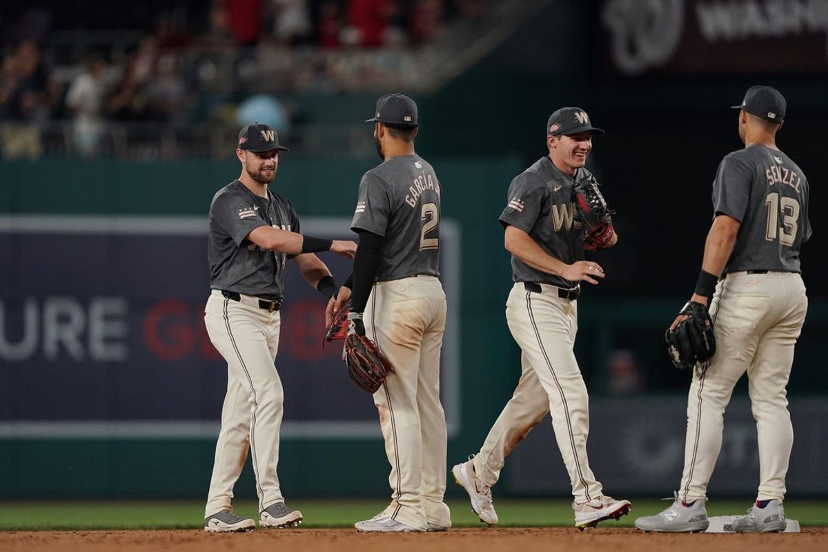 Jun 14, 2024; Washington, District of Columbia, USA; Washington Nationals players celebrate after defeating the Miami Marlins at Nationals Park. Mandatory Credit: Amber Searls-USA TODAY Sports