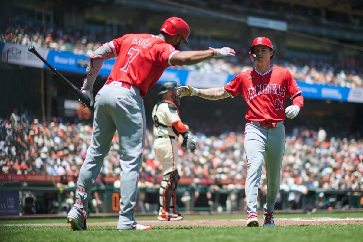 Jun 15, 2024; San Francisco, California, USA; Los Angeles Angels outfielder Mickey Moniak (16) (right) shakes hands with outfielder Jo Adell (7) after hitting a one run home run against the San Francisco Giants during the second inning at Oracle Park. Mandatory Credit: Robert Edwards-USA TODAY Sports