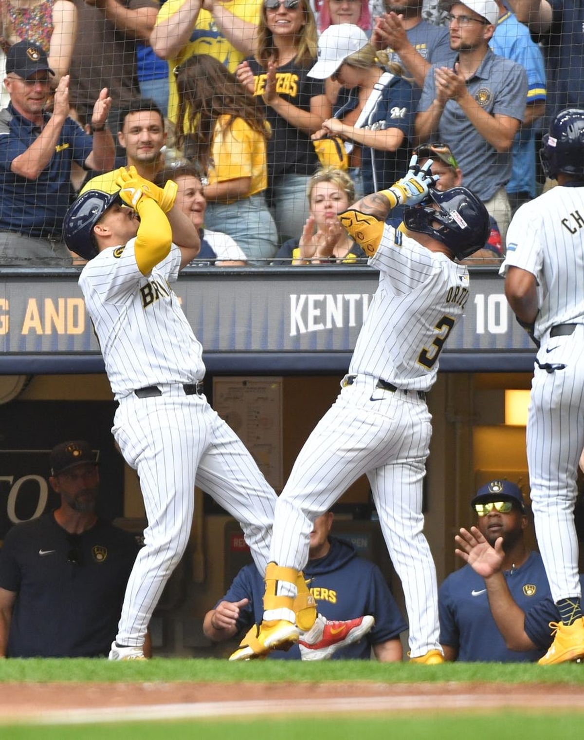 Jun 15, 2024; Milwaukee, Wisconsin, USA; Milwaukee Brewers third base Joey Ortiz (3) celebrates with Milwaukee Brewers shortstop Willy Adames (27) after hitting home run against the Cincinnati Reds in the fifth inning at American Family Field. Mandatory Credit: Michael McLoone-USA TODAY Sports