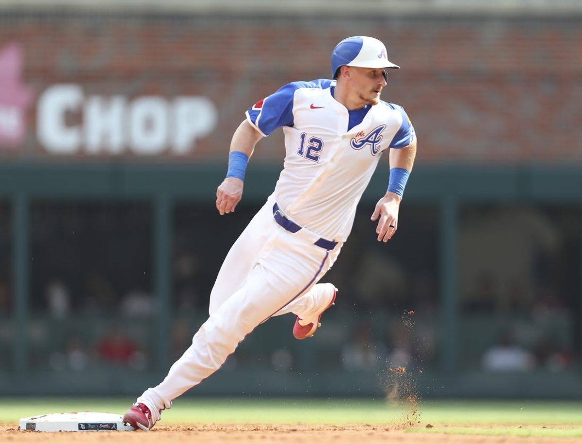 Jun 15, 2024; Cumberland, Georgia, USA; Atlanta Braves catcher Sean Murphy (12) rounds second base against the Tampa Bay Rays during the fifth inning at Truist Park. Mandatory Credit: Mady Mertens-USA TODAY Sports