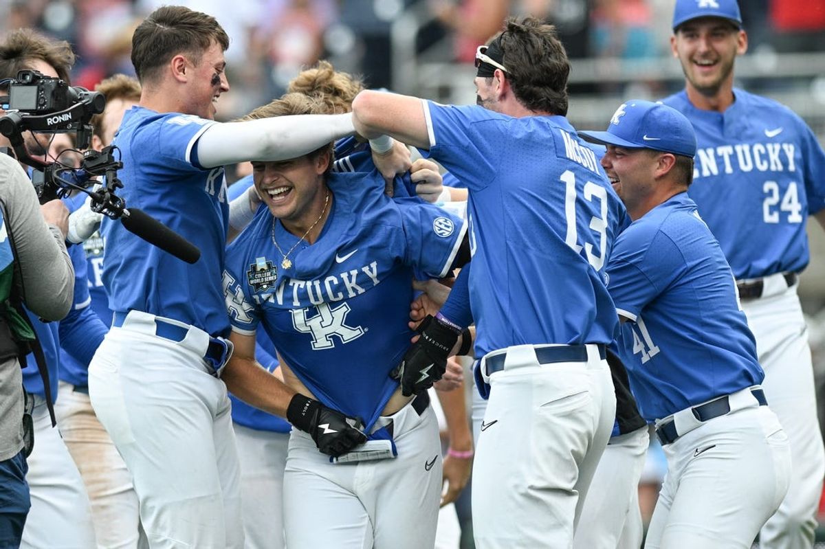 Jun 15, 2024; Omaha, NE, USA;  Kentucky Wildcats third baseman Mitchell Daly (2) and teammate celebrate after hitting a walk off home run against the NC State Wolfpack during the tenth inning at Charles Schwab Filed Omaha. Mandatory Credit: Steven Branscombe-USA TODAY Sports