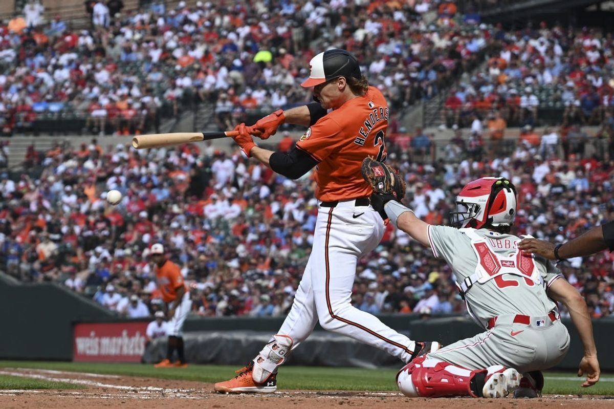 Jun 15, 2024; Baltimore, Maryland, USA;  Baltimore Orioles shortstop Gunnar Henderson (2) hits a hits an RBI  since against the Philadelphia Phillies in the third inning at Oriole Park at Camden Yards. Mandatory Credit: Tommy Gilligan-USA TODAY Sports